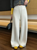 White high-waisted wide-leg trousers